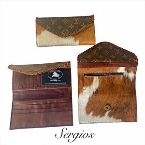 Wallets made in genuine leather and cowhide .