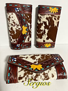 Beautiful hand tooled and paint wallet .