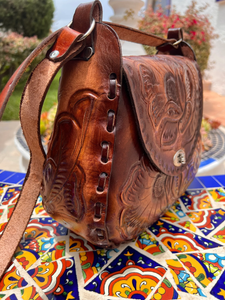 Handmade and hand tooled handbag.
