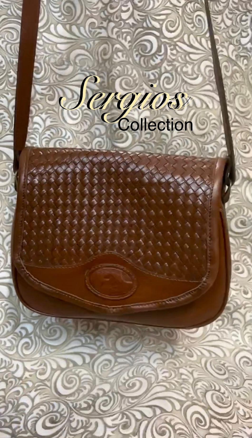 Santa Bárbara Saddle style bag with basket weave look leather
