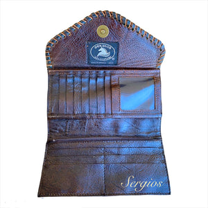 Wallets made in genuine leather and cowhide .
